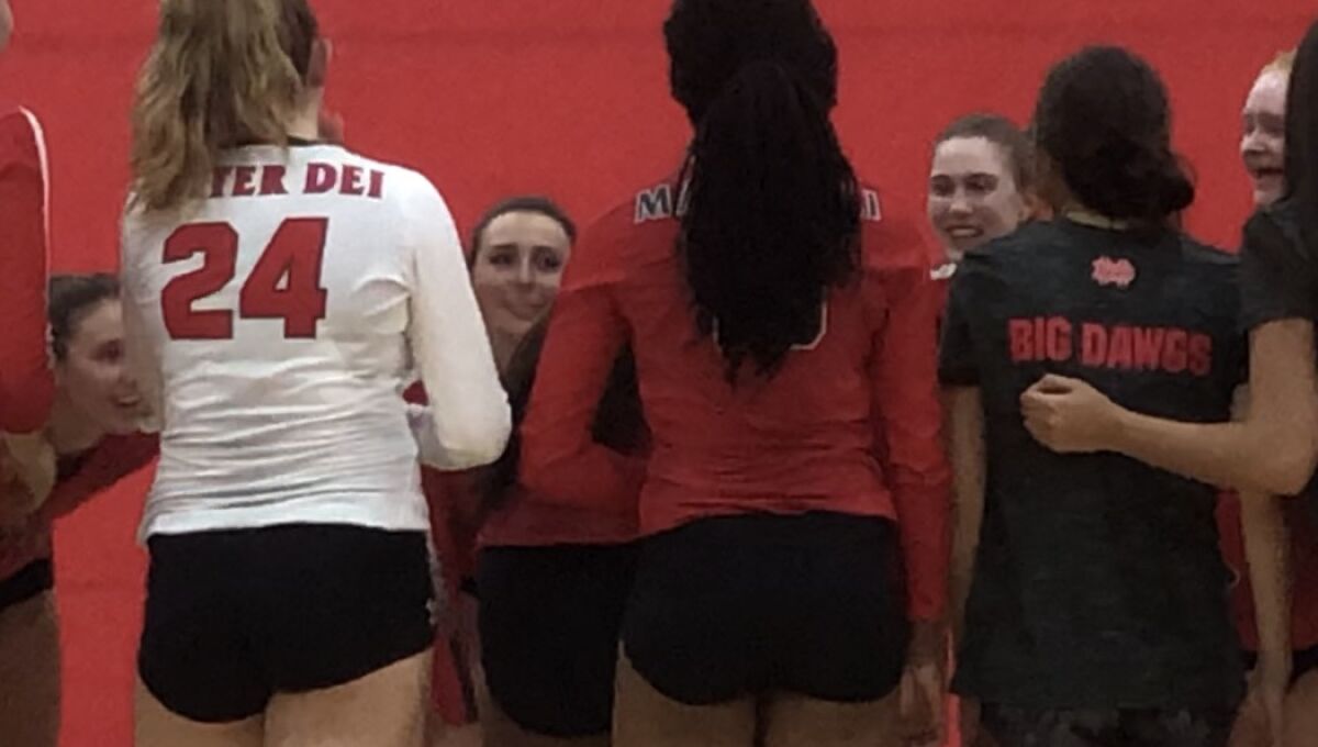 Santa Ana Mater Dei girls' volleyball players prepare for a match against No. 1 Redondo earlier this season.