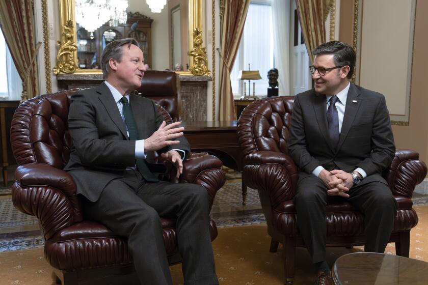 FILE - Britain's Foreign Secretary David Cameron, left, meets with Speaker of the House Mike Johnson, R-La., for discussions on the war in Ukraine, at the Capitol in Washington, Wednesday, Dec. 6, 2023. British Foreign Secretary David Cameron is expected to urge U.S. lawmakers to approve a new package of aid for Ukraine when he visits Washington this week, warning Congress that it is putting the security of the West at risk by continuing to hold up the funding. (AP Photo/J. Scott Applewhite, File)