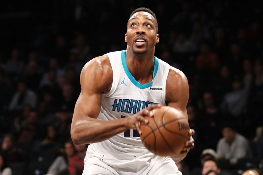 NEW YORK, NY - MARCH 21: Dwight Howard #12 of the Charlotte Hornets looks to take a shot against the Brooklyn Nets in the fourth quarter during their game at Barclays Center on March 21, 2018 in the Brooklyn borough of New York City. NOTE TO USER: User expressly acknowledges and agrees that, by downloading and or using this photograph, User is consenting to the terms and conditions of the Getty Images License Agreement. (Photo by Abbie Parr/Getty Images) ** OUTS - ELSENT, FPG, CM - OUTS * NM, PH, VA if sourced by CT, LA or MoD **