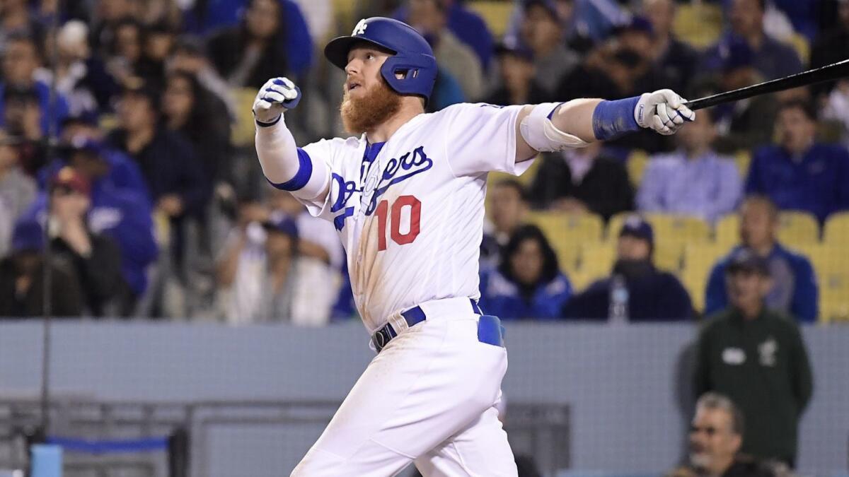 Justin Turner hits a home run, his third of the game, against the Atlanta Braves on May 7 at Dodger Stadium.
