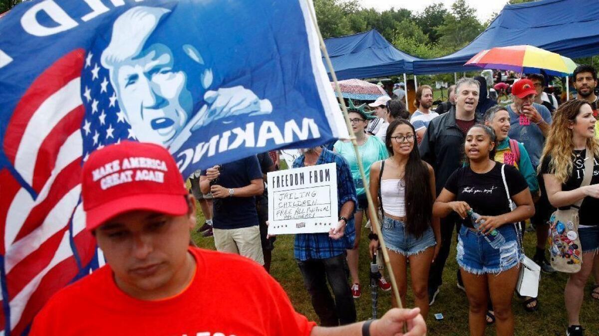 Protestors chant near a supporter of President Trump at the National Mall in Washington on July 4.