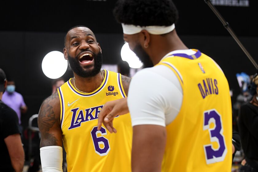 El Segundo, CA. September 28, 2021: Lakers Lebron James, left, and Anthony Davis share a laugh during media day at the UCLA Health Training Center in El Segundo Tuesday. (Wally Skalij/Los Angeles Times)