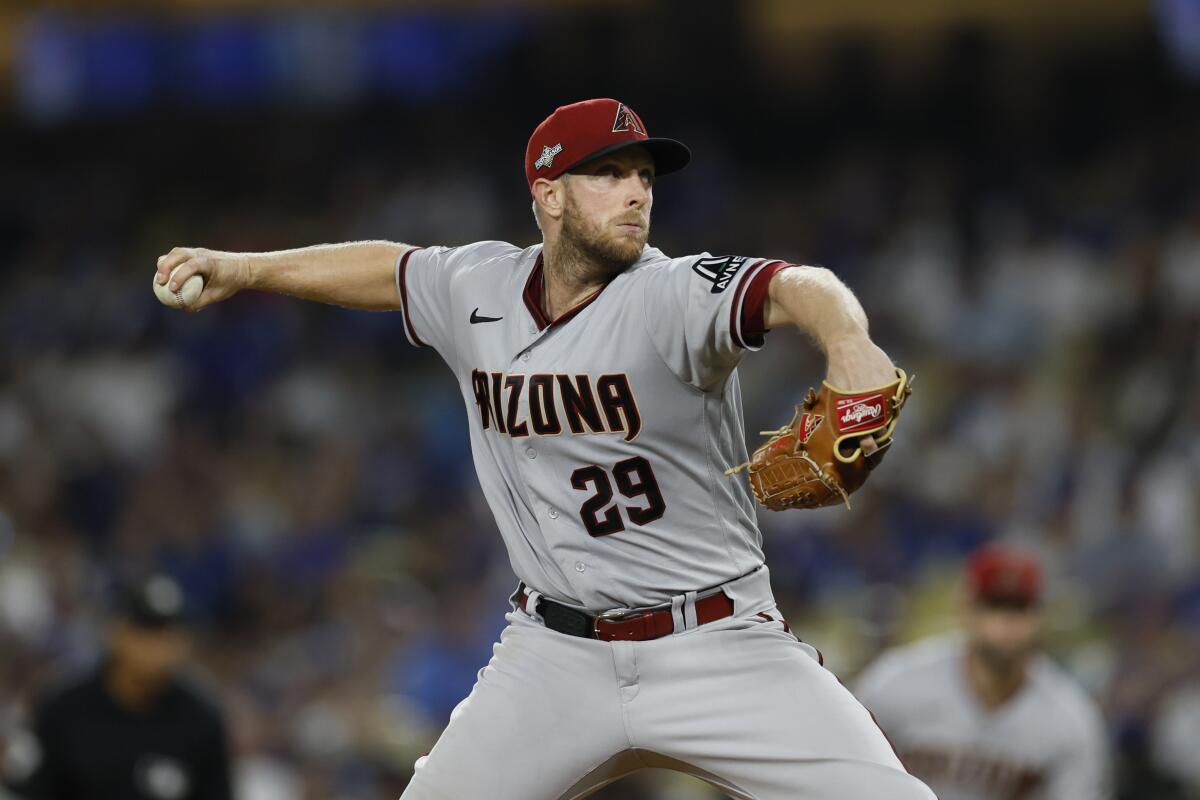 Arizona Diamondbacks starting pitcher Merrill Kelly delivers against the Dodgers in Game 1.