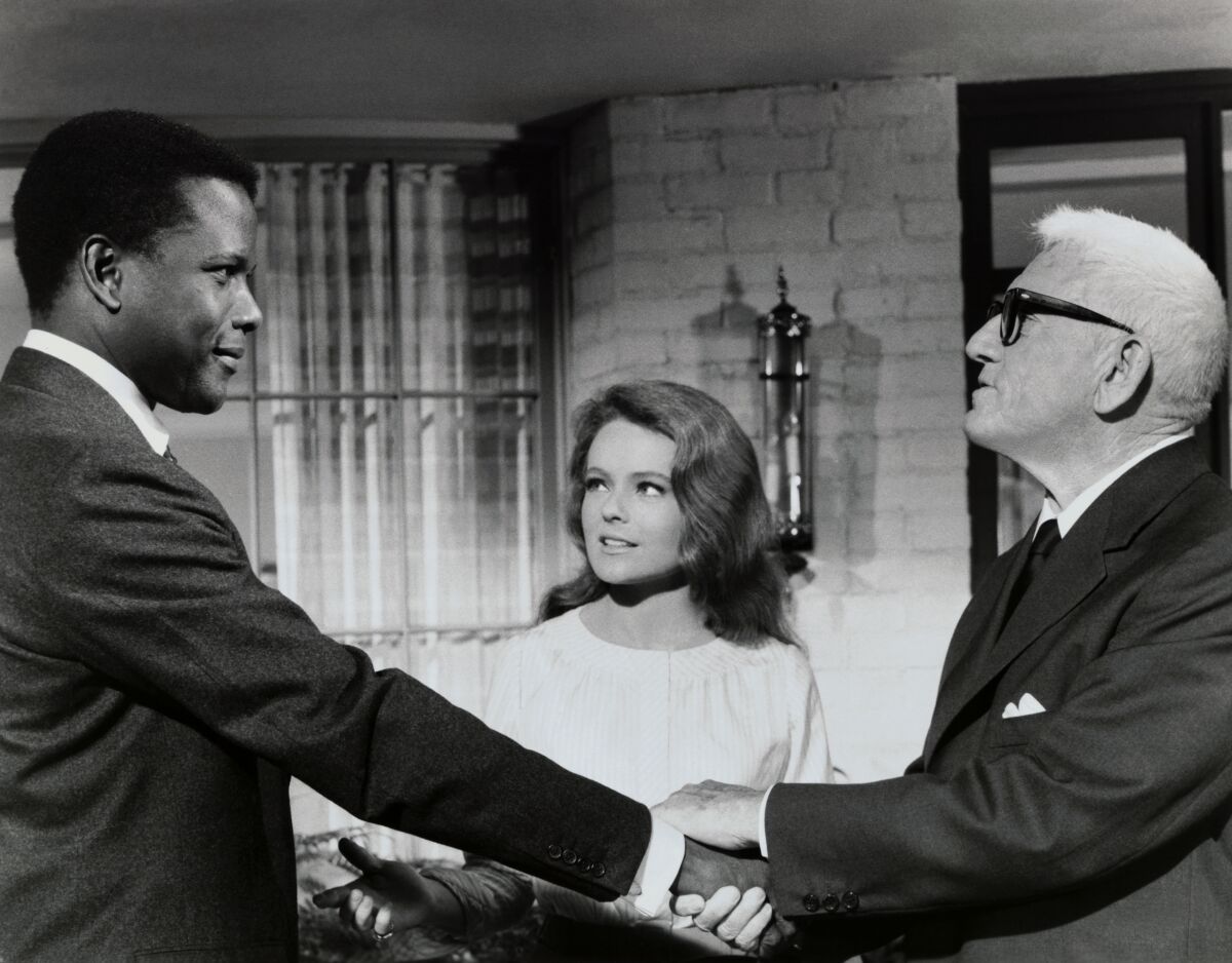 Actors Sidney Poitier, Katharine Houghton and Spencer Tracy in a scene