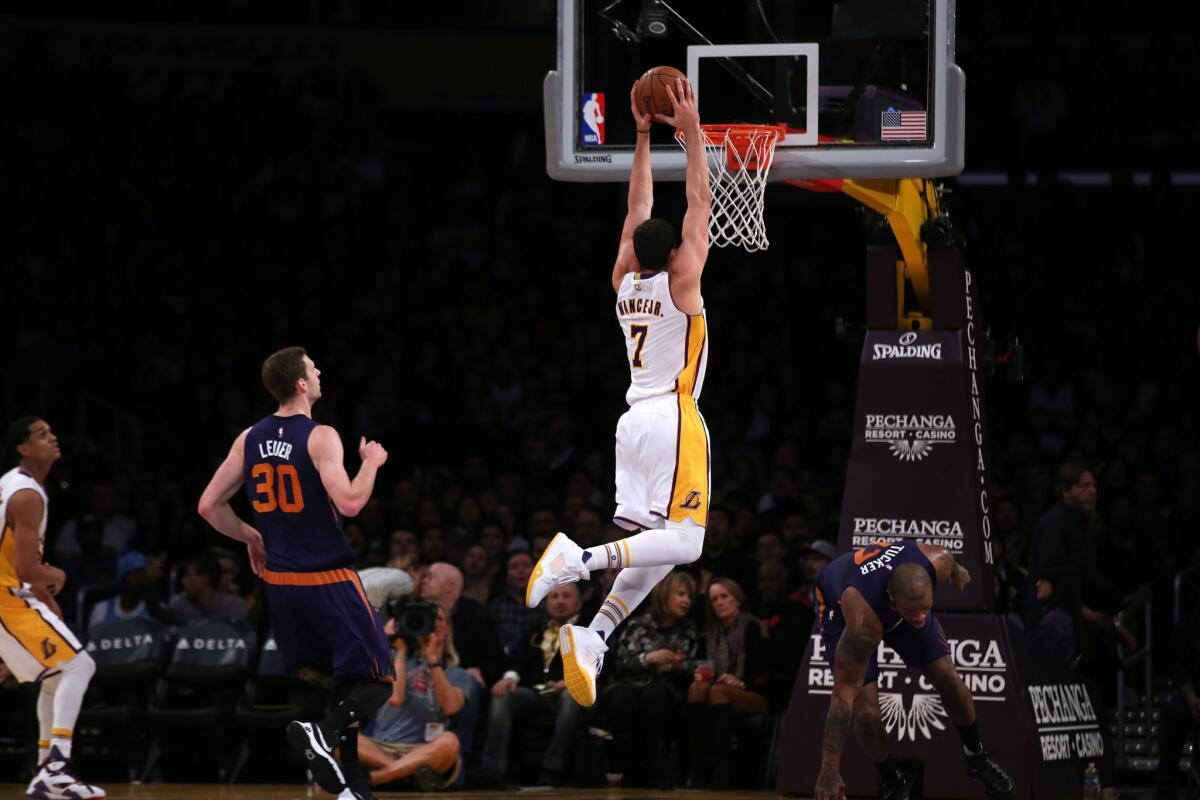 Lakers forward Larry Nance Jr. goes up for a dunk during a game against the Suns.