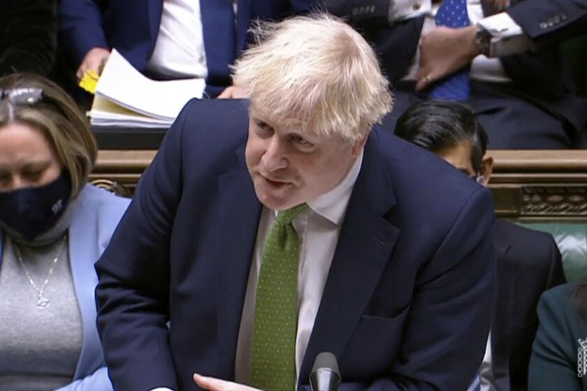 In this screen shot taken from video, Britain's Prime Minister Boris Johnson speaks during Prime Minister's Questions in the House of Commons, London, Wednesday, Jan. 19, 2022. Johnson faced a grilling from opponents in Parliament as well as a threat from his own party's lawmakers over a string of lockdown-flouting government parties. Conservative legislators are judging whether to trigger a no-confidence vote in Johnson over the “partygate” scandal. Johnson and loyal ministers are trying to bring rebels back into line before they submit letters to a party committee calling for the vote. (House of Commons/PA via AP)