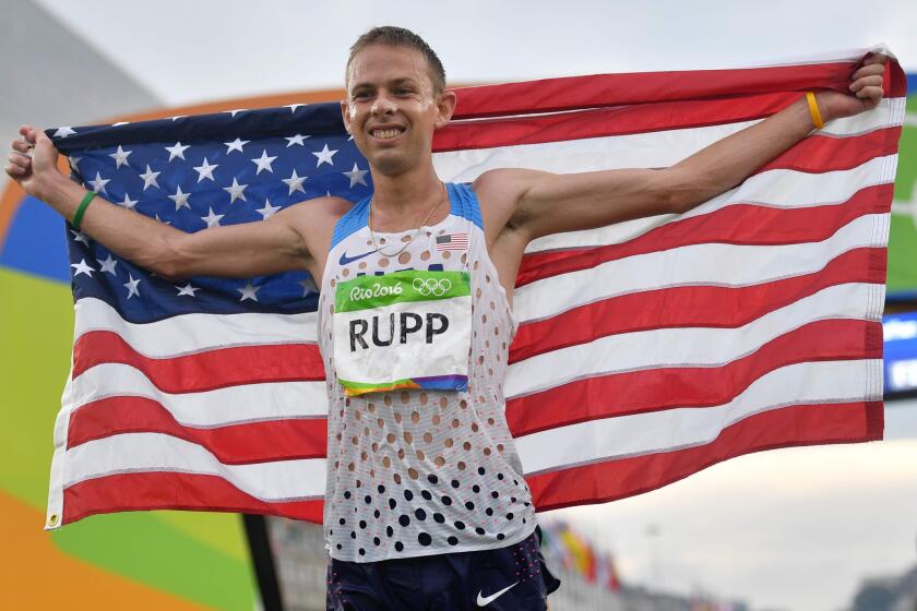 U.S. runner Galen Rupp celebrates after crossing the finish line and winning the bronze medal in the men's marathon on Aug. 21.