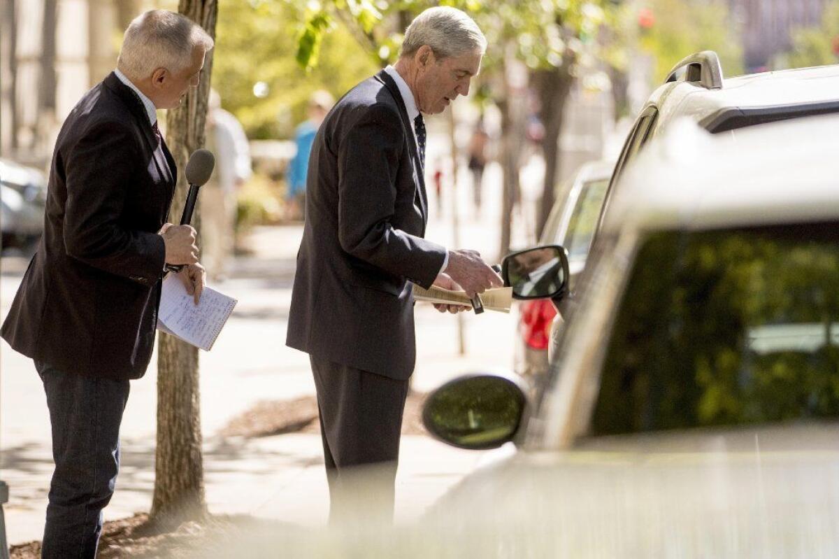 Special counsel Robert S. Mueller III brushes off a reporter on April 21. He hasn't spoken publicly about the investigation.