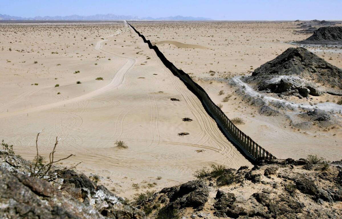 Dubbed "the longest fence," this portion of the U.S. border wall stretches about 40 miles across the desert east of San Luis, Arizona. The Mexican state of Sonora is on the right.