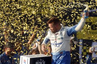 Driver Ricky Stenhouse Jr. celebrates in Victory Lane after a NASCAR Cup Series auto race at Talladega Superspeedway, Sunday, Oct. 6, 2024, in Talladega, Ala. (AP Photo/ Butch Dill)