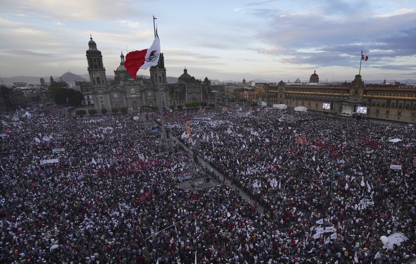 Mexican President Andres Manuel Lopez Obrador speaks to the crowd at a rally to commemorate his third anniversary in office, in the main square of the capital, the Zocalo, in Mexico City, Wednesday, Dec. 1, 2021. (Photo AP/Marco Ugarte)