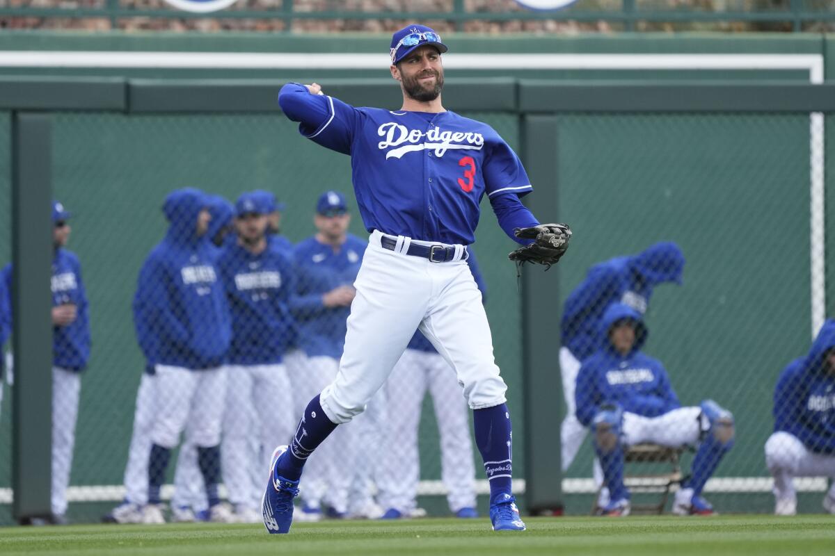 Dodgers left fielder Chris Taylor throws the ball back after making a catch against the Chicago Cubs on Feb. 26.