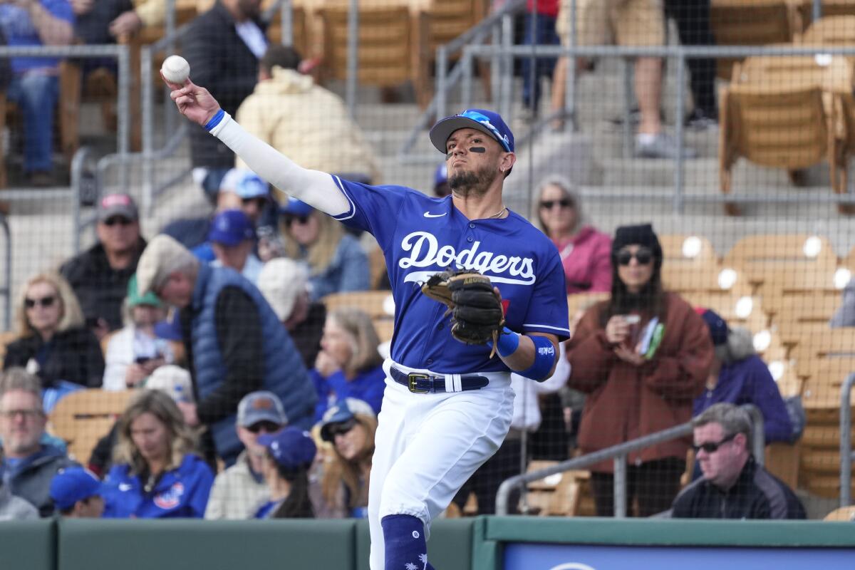 Dodgers shortstop Miguel Rojas warms up prior to a spring training game against the Chicago Cubs.