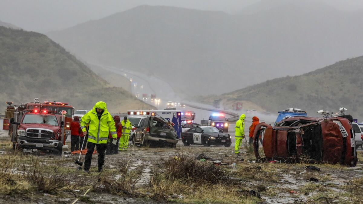 Cars and debris are scattered alongside the 5 Freeway near Gorman where a Ventura County search-and-rescue team member was killed and at least nine other people were injured in a multicar crash Saturday morning.