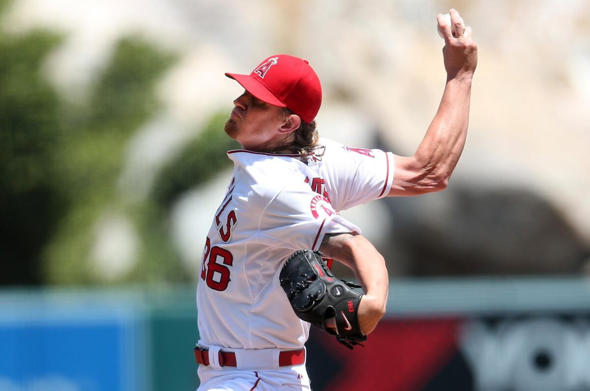 Angels starter Jered Weaver went five innings against the Orioles on Sunday, giving up four hits and two runs while striking out seven and walking none in his return from a seven-week layoff.