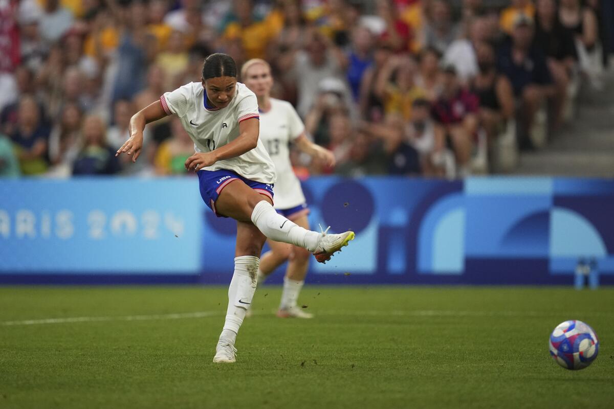 United States' Sophia Smith fires a shot during a women's Group B soccer match between Australia.