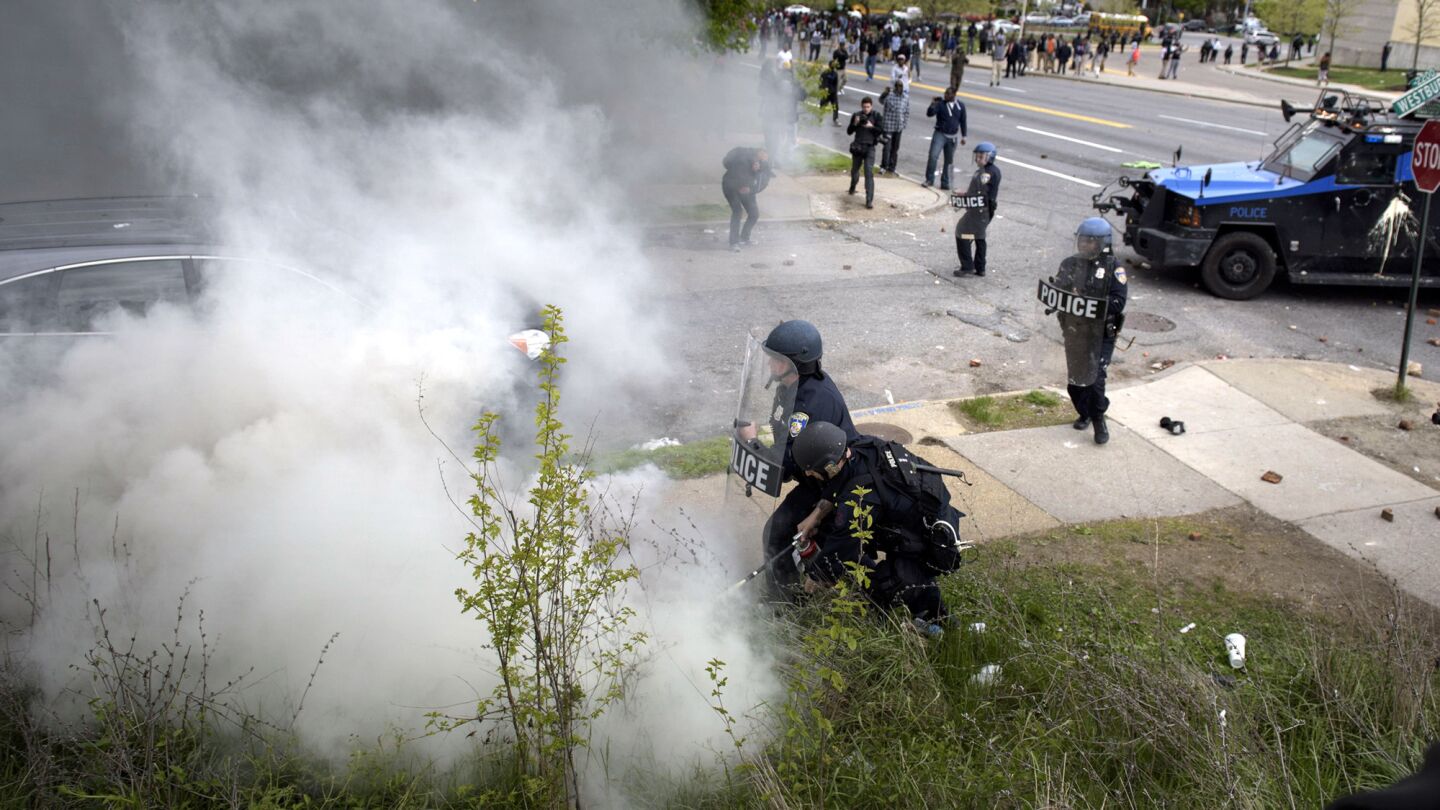 Baltimore police on Monday put out a fire caused by a teargas canister during protests over the death of Freddie Gray.