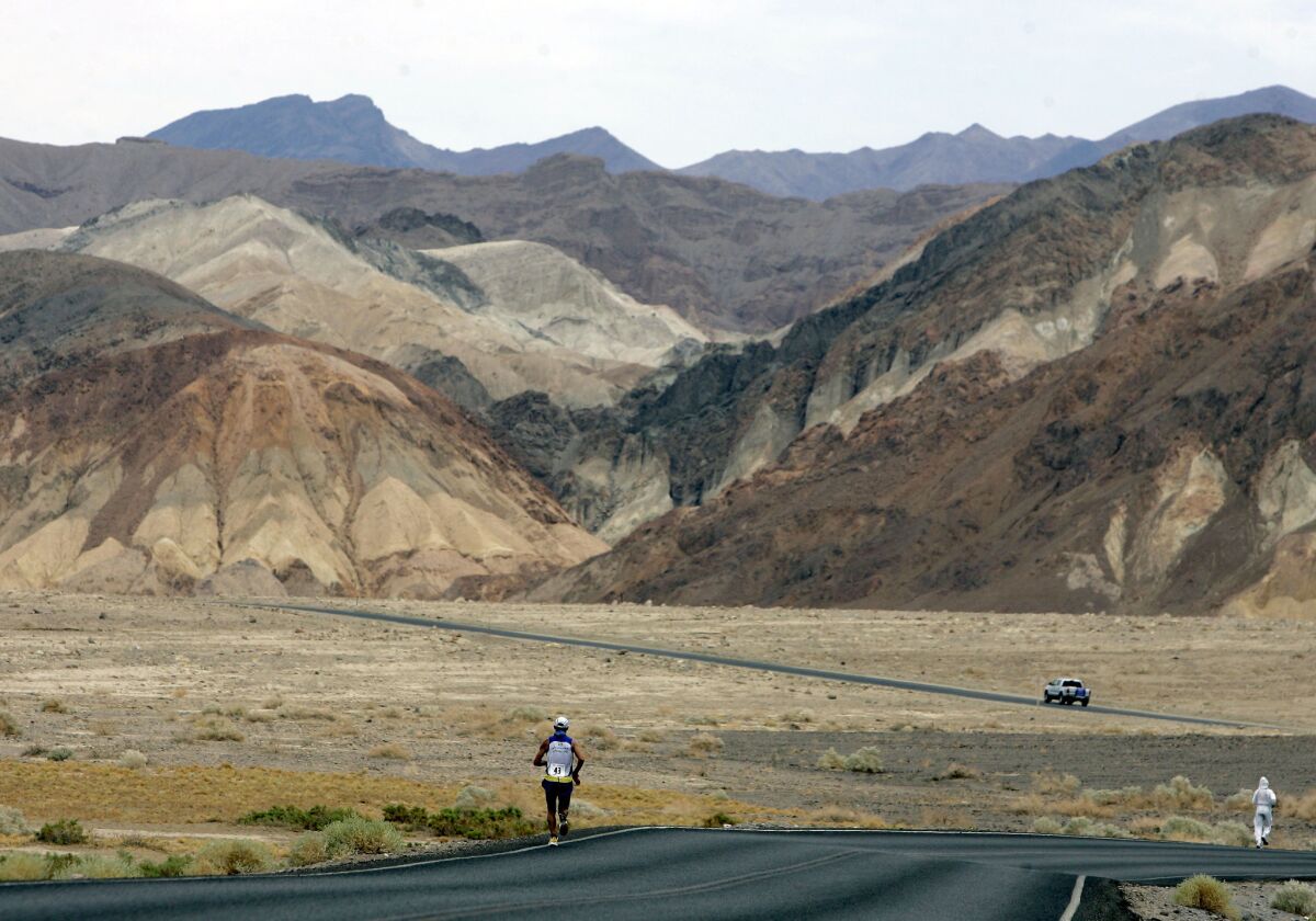In this July 23, 2007, photo, Valmir Nunes of Brazil runs in the Badwater 135 Ultramarathon in Death Valley. The national park is suspending permits for endurance events, citing safety concerns.