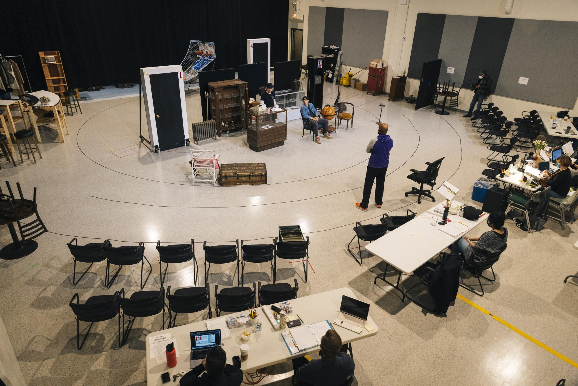 Amid a makeshift set, director Kenny Leon directs a scene. 