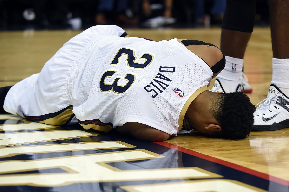 New Orleans' Anthony Davis is injured during the first half Saturday against the Chicago Bulls at the Smoothie King Center.