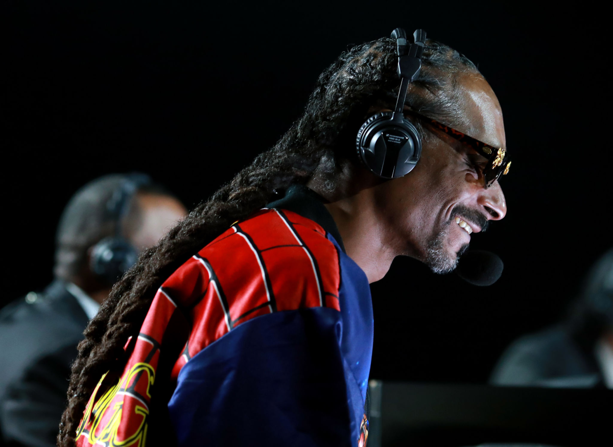 Snoop Dogg provides commentary during the Mike Tyson vs. Roy Jones Jr. boxing exhibition at Staples Center on Saturday