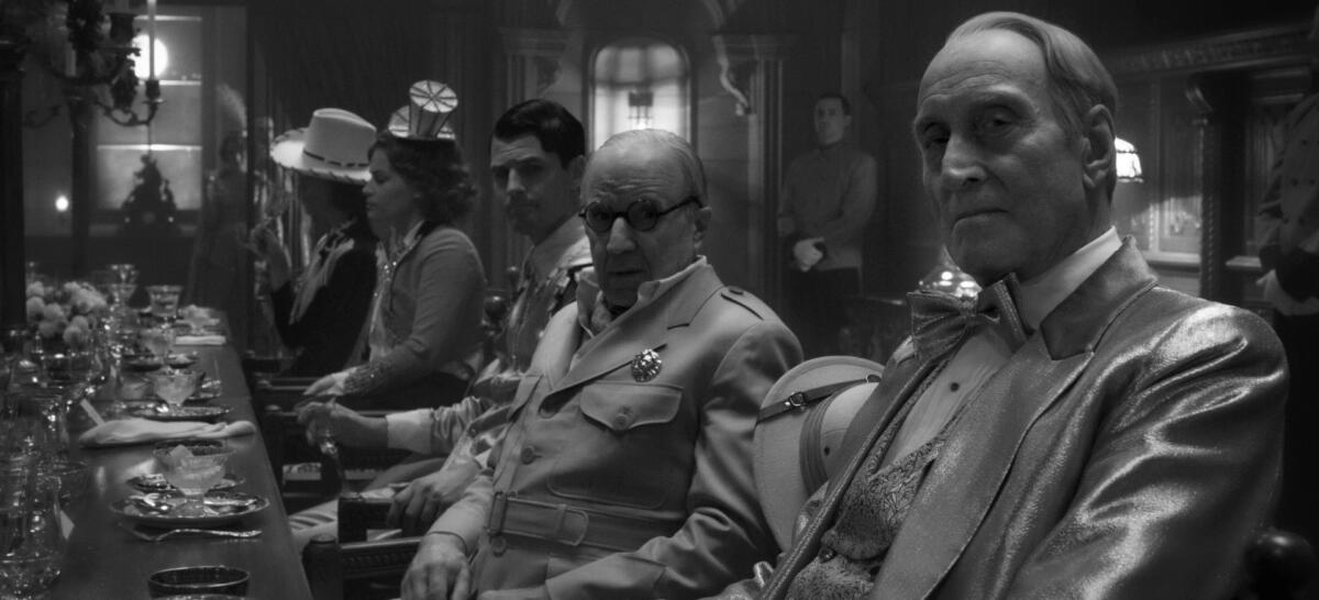 Charles Dance, far right, stars as William Randolph Hearst with Arliss Howard as Louis B. Mayer in "Mank."