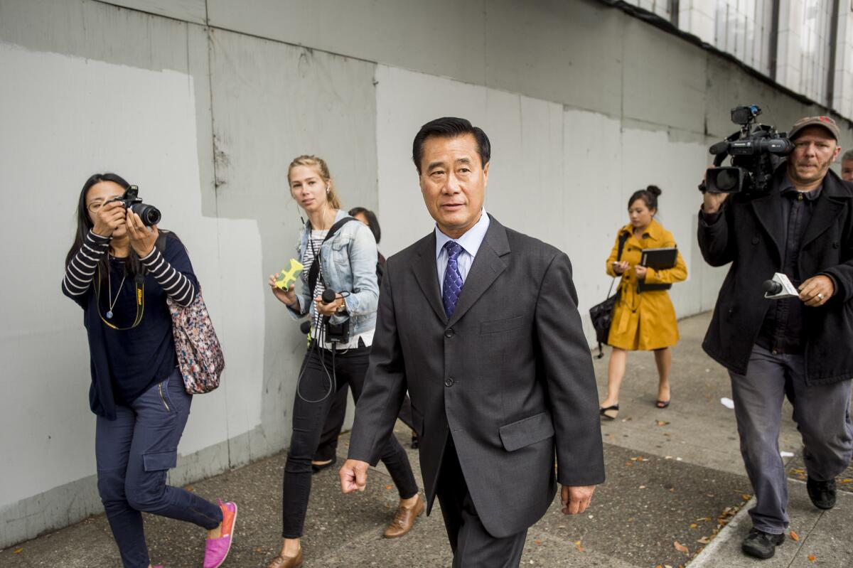 California state Sen. Leland Yee leaves federal court in San Francisco Thursday after he pleaded not guilty to charges including racketeering.