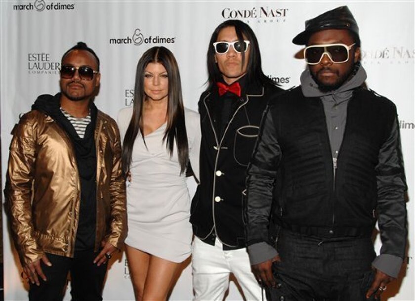 FILE - In this March 12, 2009 file photo, the Black Eyed Peas, from left, apl.de.ap, Fergie, Taboo and Will.i.am attend the 34th annual March of Dimes Beauty Ball, in New York. (AP Photo/Peter Kramer, file)