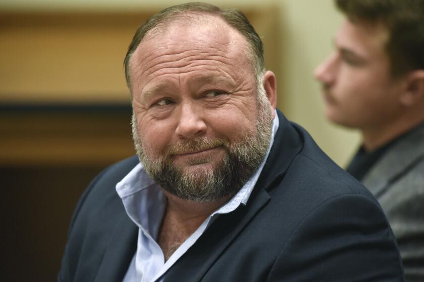 FILE - Infowars founder Alex Jones appears in court to testify during the Sandy Hook defamation damages trial at Connecticut Superior Court in Waterbury, Conn., on Sept. 22, 2022. Lawyers for several Sandy Hook families are criticizing Alex Jones' personal spending as they seek nearly $1.5 billion they won in lawsuits against the Infowars host, for his calling the 2012 Newtown school shooting that killed 26 a hoax. (Tyler Sizemore/Hearst Connecticut Media via AP, Pool, File)