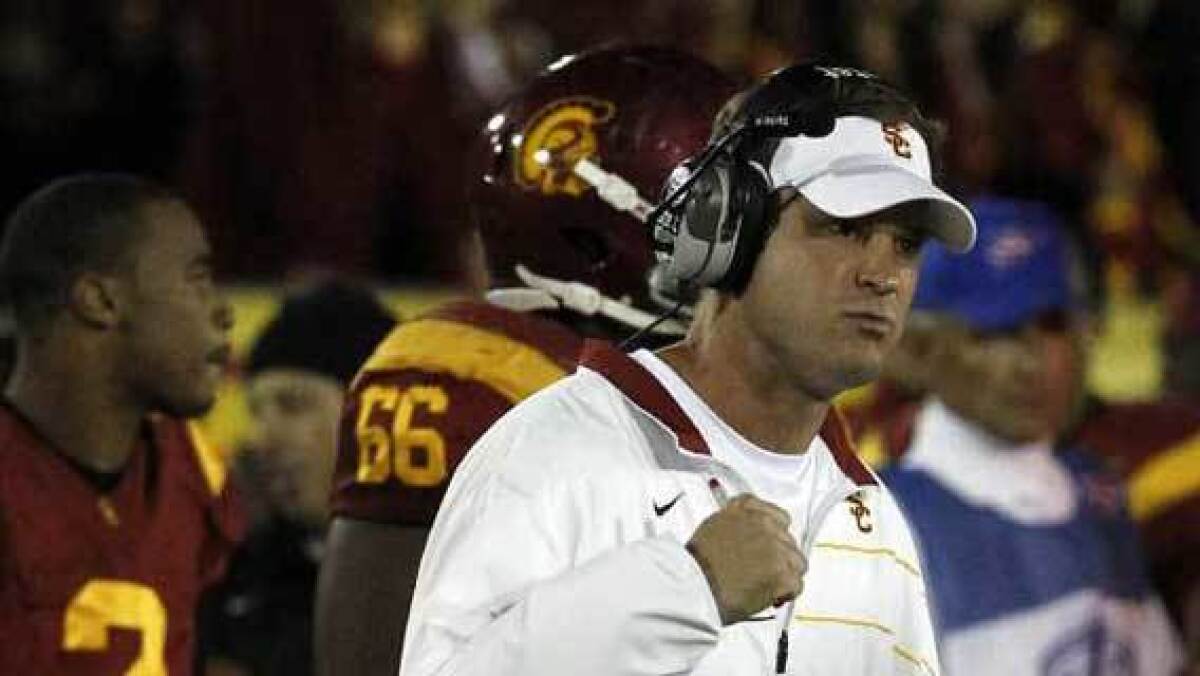 USC football coach Lane Kiffin reacts during a rivalry game against UCLA on Nov. 26, 2011, at the Coliseum.