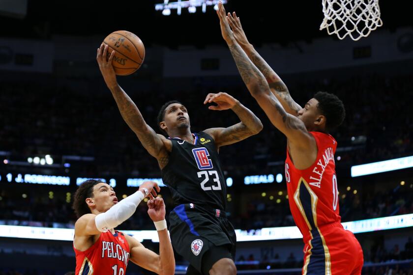 NEW ORLEANS, LOUISIANA - JANUARY 18: Lou Williams #23 of the LA Clippers shoots against Nickeil Alexander-Walker #0 of the New Orleans Pelicans and Jaxson Hayes #10 during the second half at the Smoothie King Center on January 18, 2020 in New Orleans, Louisiana. NOTE TO USER: User expressly acknowledges and agrees that, by downloading and or using this Photograph, user is consenting to the terms and conditions of the Getty Images License Agreement. (Photo by Jonathan Bachman/Getty Images)