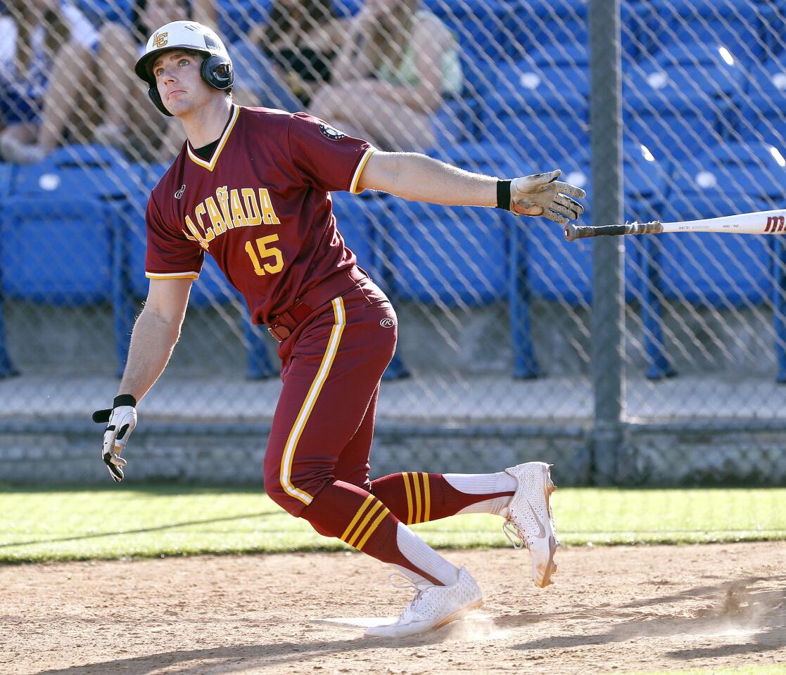 La Canada's Connor Buchanan tosses back his bat, watching a home run ball in flight leave the park in the seventh inning against San Marino in a Rio Hondo League baseball game at San Marino High School in San Marino on Friday, April 12, 2019.