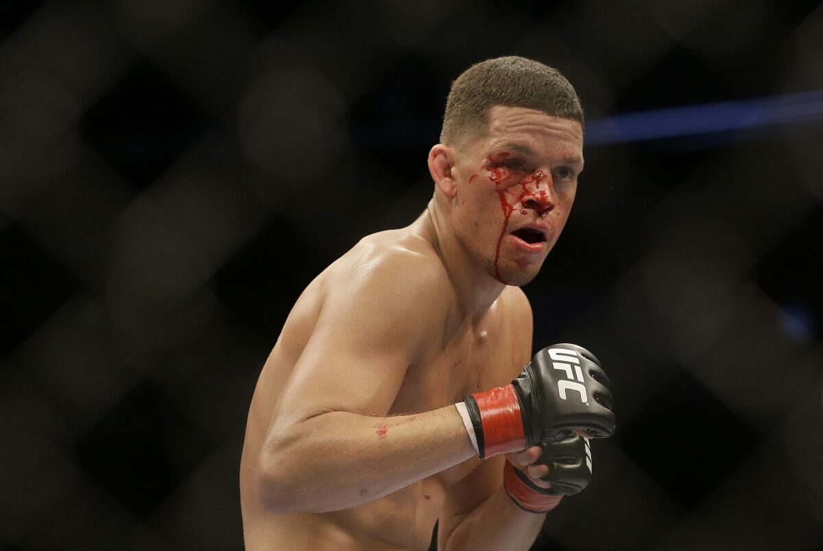 Nate Diaz fights Josh Thomson in a UFC lightweight mixed martial arts fight in San Jose, Calif., Saturday, April 20, 2013. Thomson won by technical knock out in the second round. (AP Photo/Jeff Chiu)