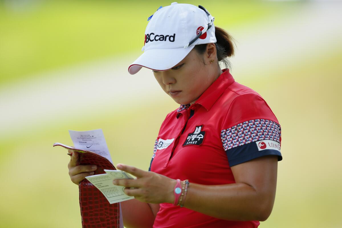 Ha Na Jangchecks her yardage card on the second green during the third round of the Marathon Classic on Saturday.