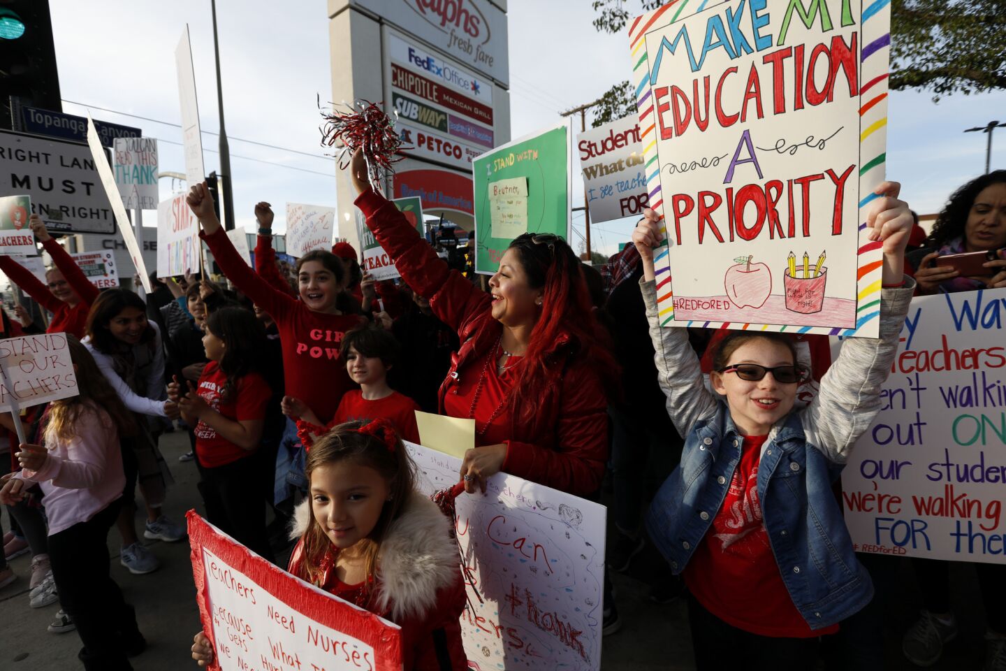 Parents, teachers, and students rally in support of teachers at the corner of Topanga Canyon and Ventura Blvd. in Woodland Hills.