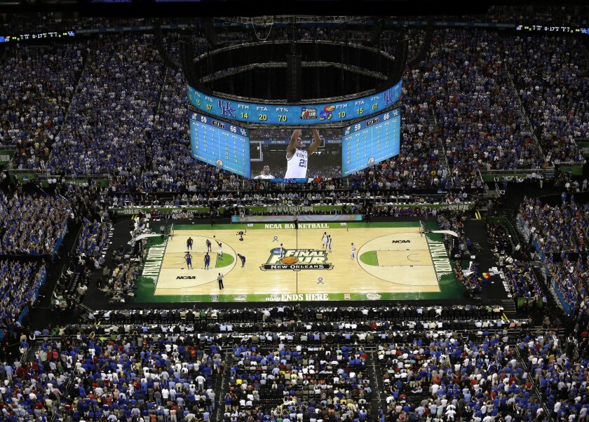 FILE - Kentucky and Kansas play in the NCAA college basketball Final Four championship game at the Superdome in New Orleans, Monday, April 2, 2012. Expect the NCAA Men's Final Four to have a more familiar look and feel to it this spring — and not just because it'll be in New Orleans for a record sixth time. A capacity crowd of about 70,000 in the Superdome for the games themselves is only the beginning. (AP Photo/David J. Phillip, File)