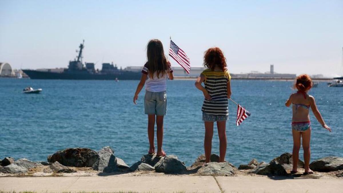 Sisters, from left, Ellie, Molly and Sophie Peel watched Fleet Week's 2016 Sea and Air Parade from Harbor Island.