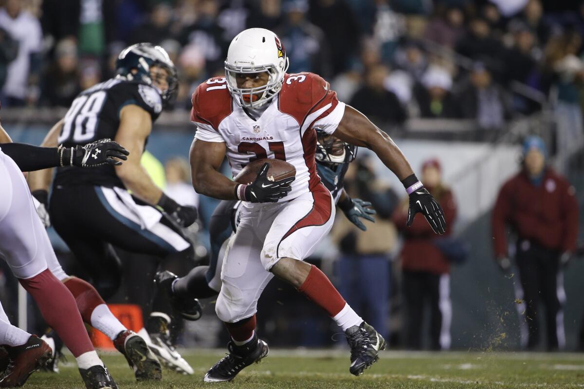 Cardinals running back David Johnson rushes for one of his three touchdowns against the Eagles.