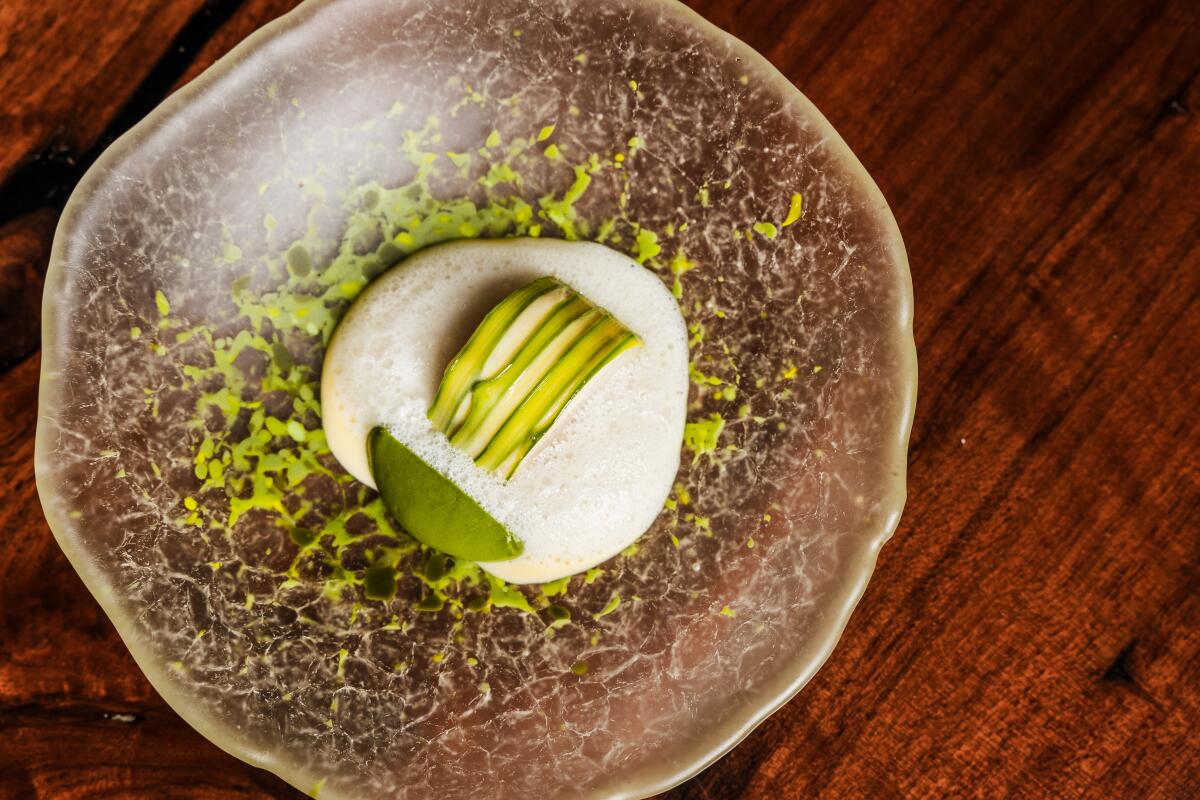 San Francisco, CA - May 20: Black cod, asparagus, spiced yogurt foam, vin jaune beurre blanc at Atelier Crenn on Wednesday, May 21, 2025 in San Francisco, CA. (Carolyn Fong / For The Times)