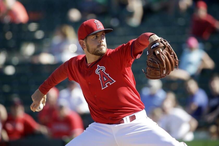 Angels pitcher Cory Rasmus delivers against the Brewers during an exhibition game on March 5.