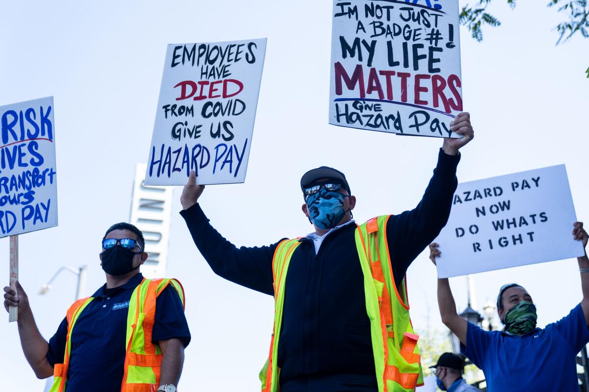 Metro bus drivers protest in downtown Los Angeles demanding hazard pay for working during the COVID-19 pandemic.