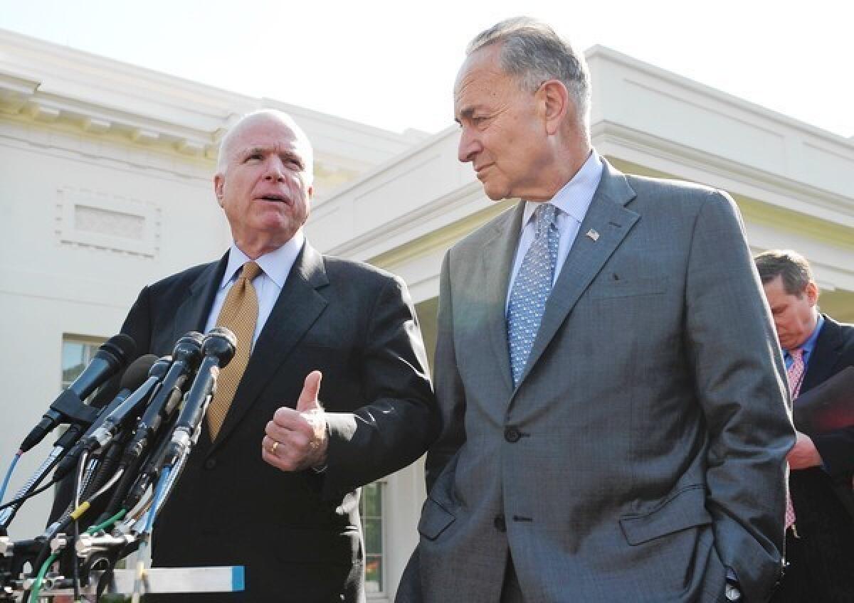 Sens. John McCain (R-Ariz.), left, and Charles E. Schumer (D-N.Y.) speak to reporters after meeting with President Obama to discuss the bipartisan immigration proposal.