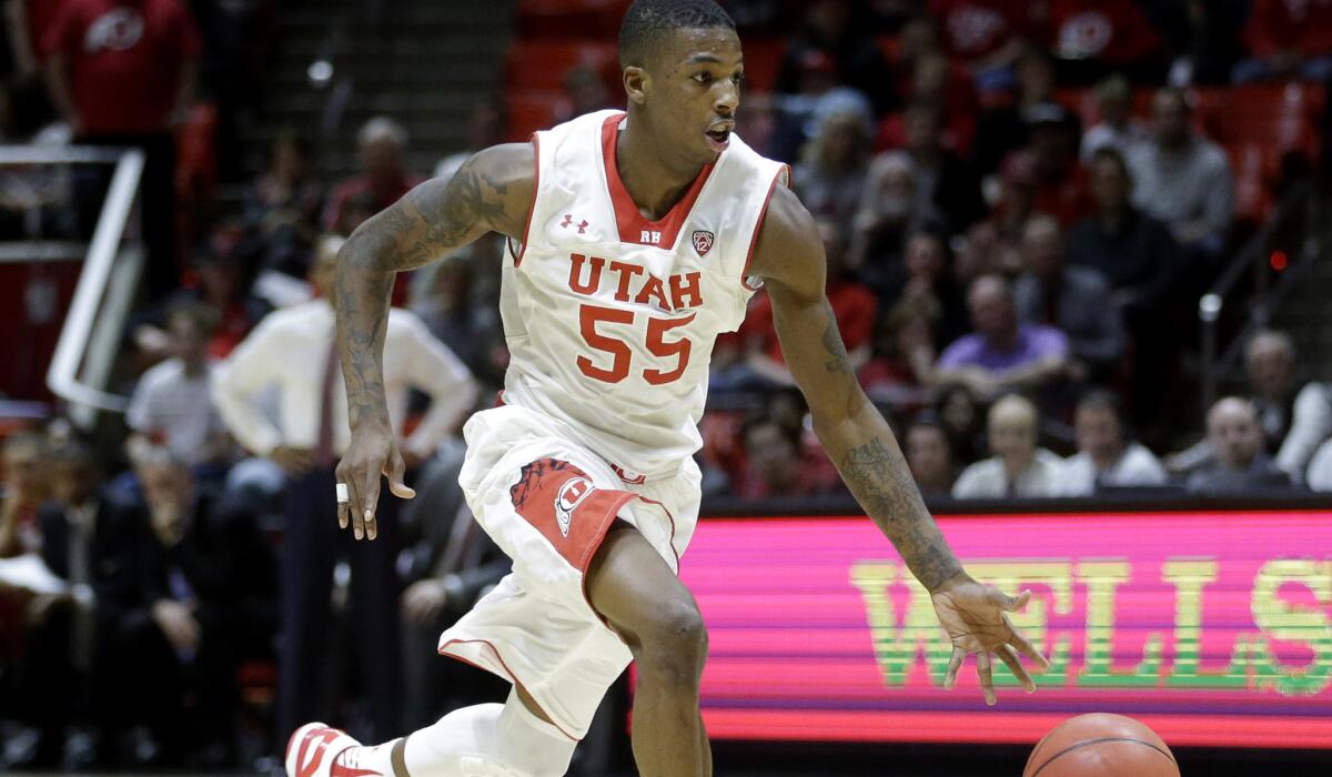 Utah guard Delon Wright (55) brings the ball up court against Stanford in the second half Thursday night in Salt Lake City.