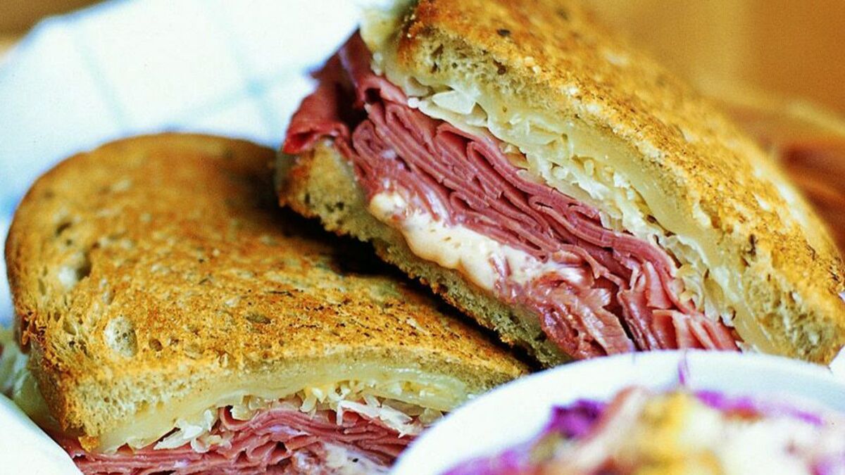 ** FOR USE WITH AP WEEKLY FEATURES ** This photo provided by The Culinary Institute of America shows a Reuben, the ultimate deli sandwich. The classic recipe calls for it to be made with rye bread and Russian dressing, piled high with corned beef, Swiss cheese and sauerkraut, then grilled until golden. (AP Photo/CIA/Ben Fink)