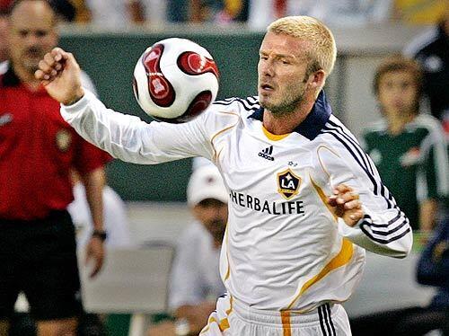 Soccer star David Beckham made his long-awaited debut with the Los Angeles Galaxy in an exhibition against the English club Chelsea Saturday night. Beckham, who is nursing an ankle he injured June 6 while playing for his native England against Estonia, played the last 12 minutes of regulation, plus four minutes of stoppage time in a 1-0 loss. Despite the late entry of the sport's glamour boy, the match was watched on ESPN by nearly 1.5 million people