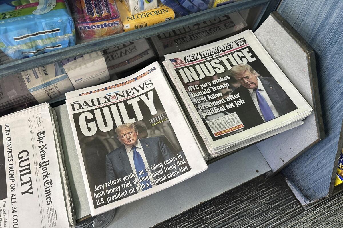 Newspapers reporting former President Trump's conviction are seen on sale in New York on May 31. 