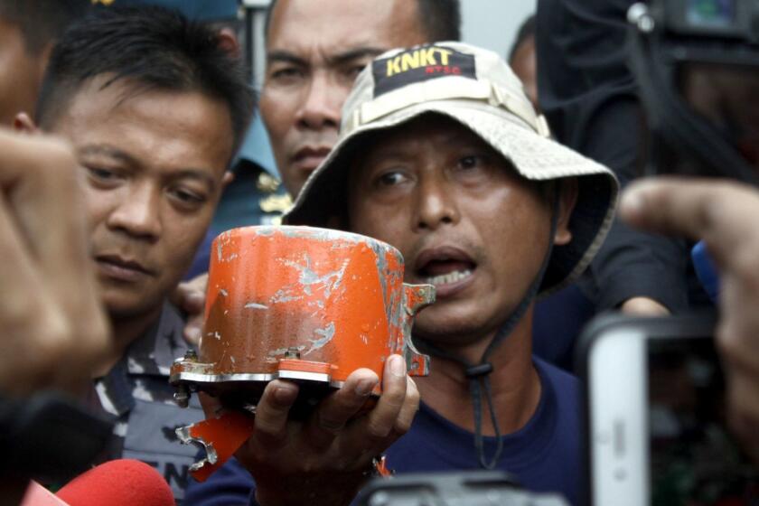 Mandatory Credit: Photo by ADITYA IRAWAN/EPA-EFE/REX (10056153a) A member of the Indonesian National Commission of Transportation Safety shows the Cockpit Voice Recorder (CVR) of the Lion Air JT-610 shortly after it was found underwater, in Kerawang, Indonesia, 14 January 2019. According to media reports, Indonesian officials found the cockpit voice recorder from Lion Air flight JT-610. The plane lost contact with air traffic controllers soon after takeoff then crashed into the sea off the coast of Jakarta on 29 October. The flight was en route to Pangkal Pinang, and all 189 people onboard the Boeing 737 MAX passenger jet were killed in the plane crash. Indonesian officials find cockpit voice recorder from Lion Air JT610 plane crash, Kerawang, Indonesia - 14 Jan 2019 ** Usable by LA, CT and MoD ONLY **
