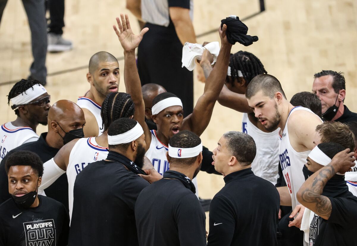 Clippers guard Rajon Rondo vehemently reminds his teammates to raise their hands on defense.