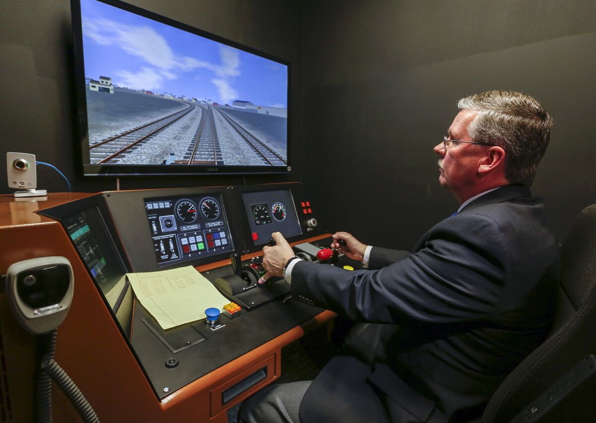 A Metrolink official demonstrates its Positive Train Control system at a training facility in Los Angeles on Feb. 20, 2014. 