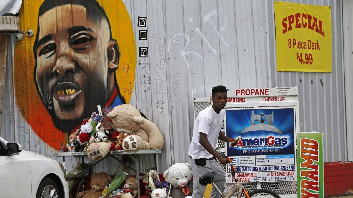 A mural of Alton Sterling painted on the exterior wall of the Baton Rouge, La., convenience store where he was fatally shot by police on July 5, 2016.